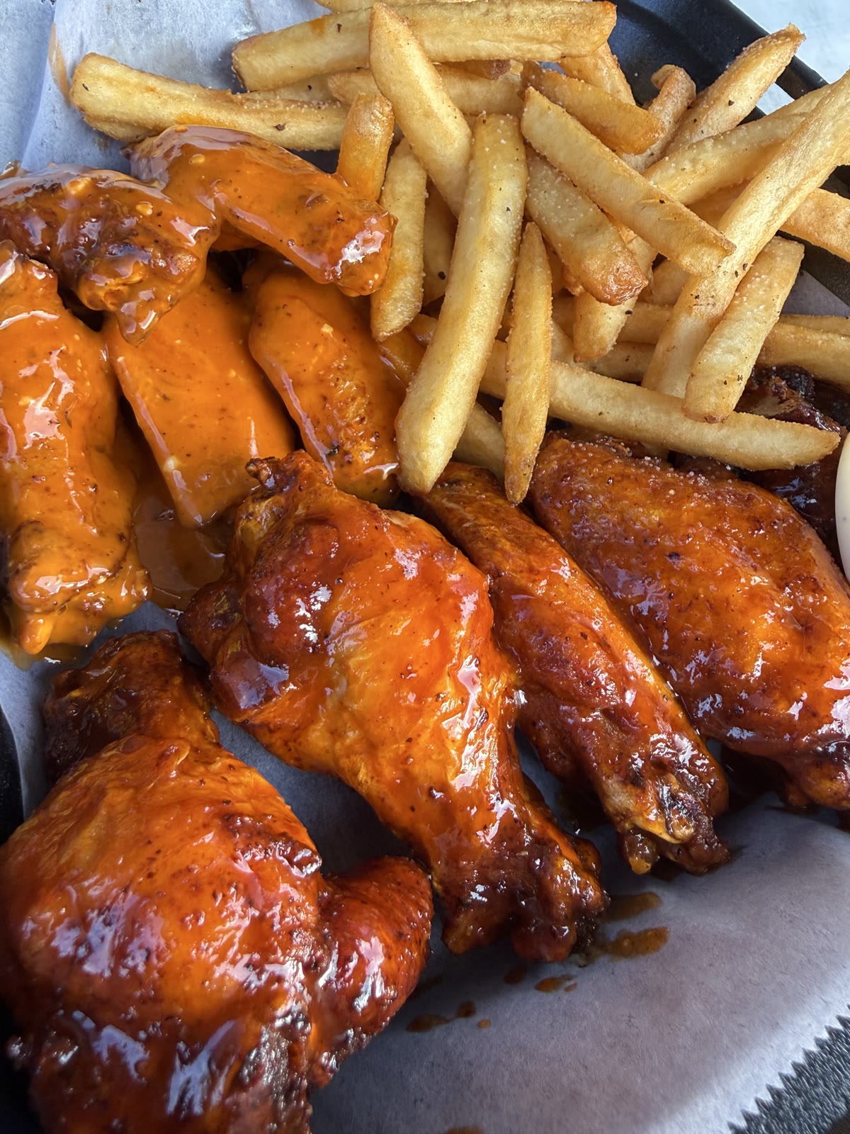 Sauced traditional wings with fries